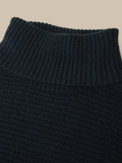Dark gray pants with a close-up of the waistband on a white background