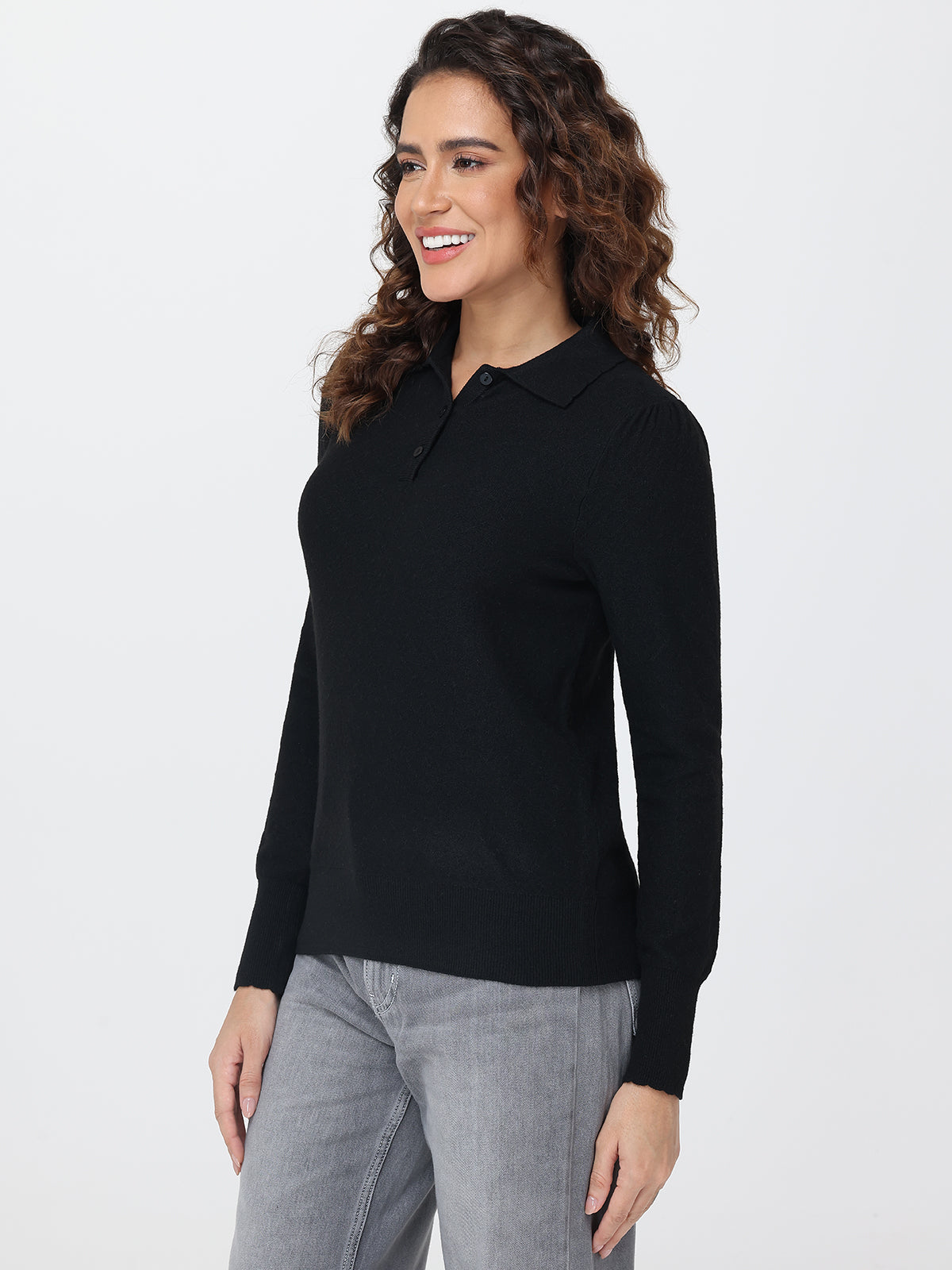 Woman wearing a black long-sleeve shirt on a white background