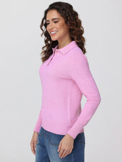 Woman wearing a pink long-sleeve shirt against a plain background
