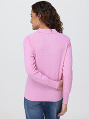 Woman wearing a pink sweater on a white background
