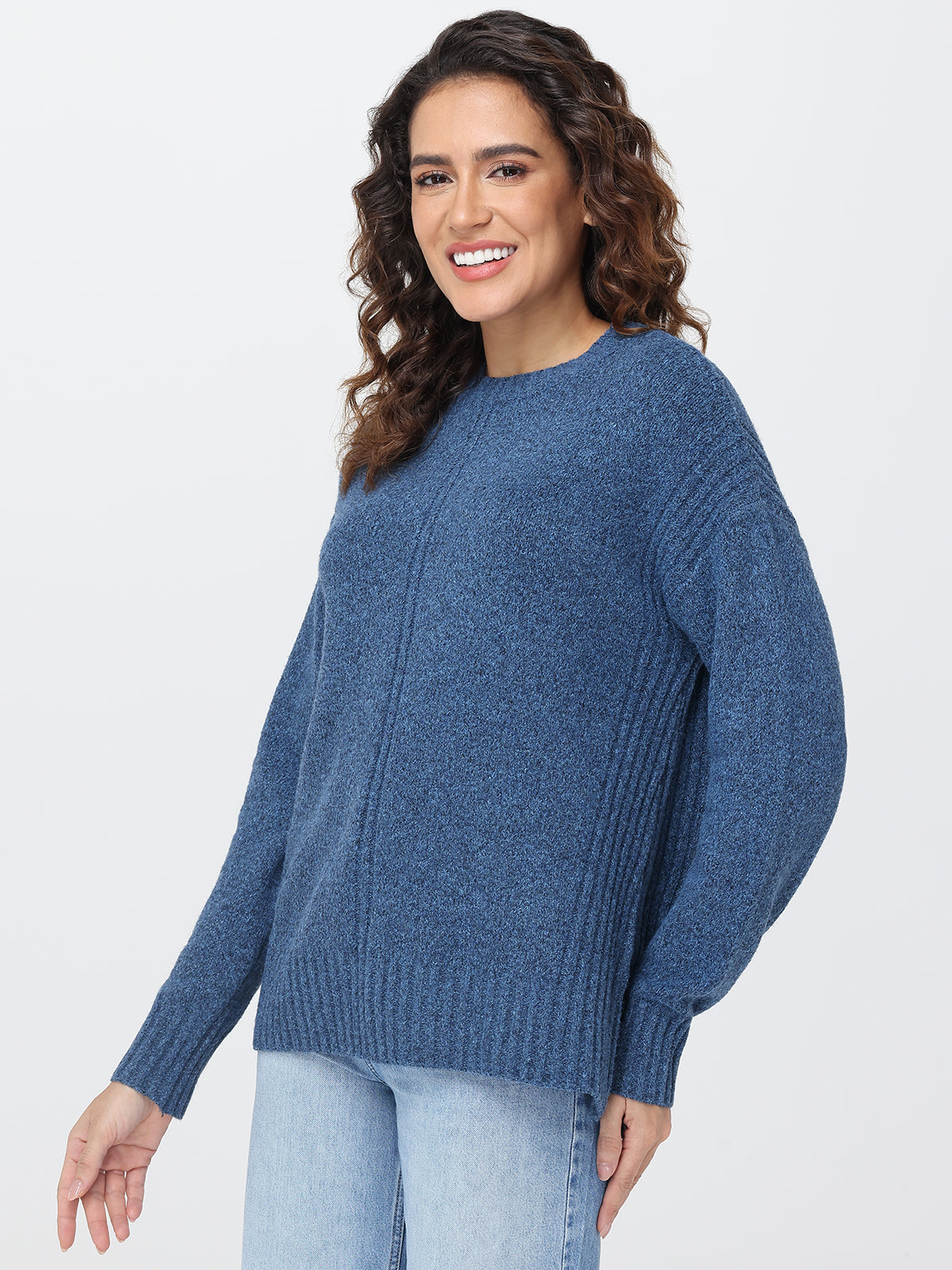Woman wearing a blue sweater on a white background