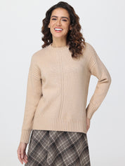 Woman wearing a beige sweater and plaid skirt on a white background