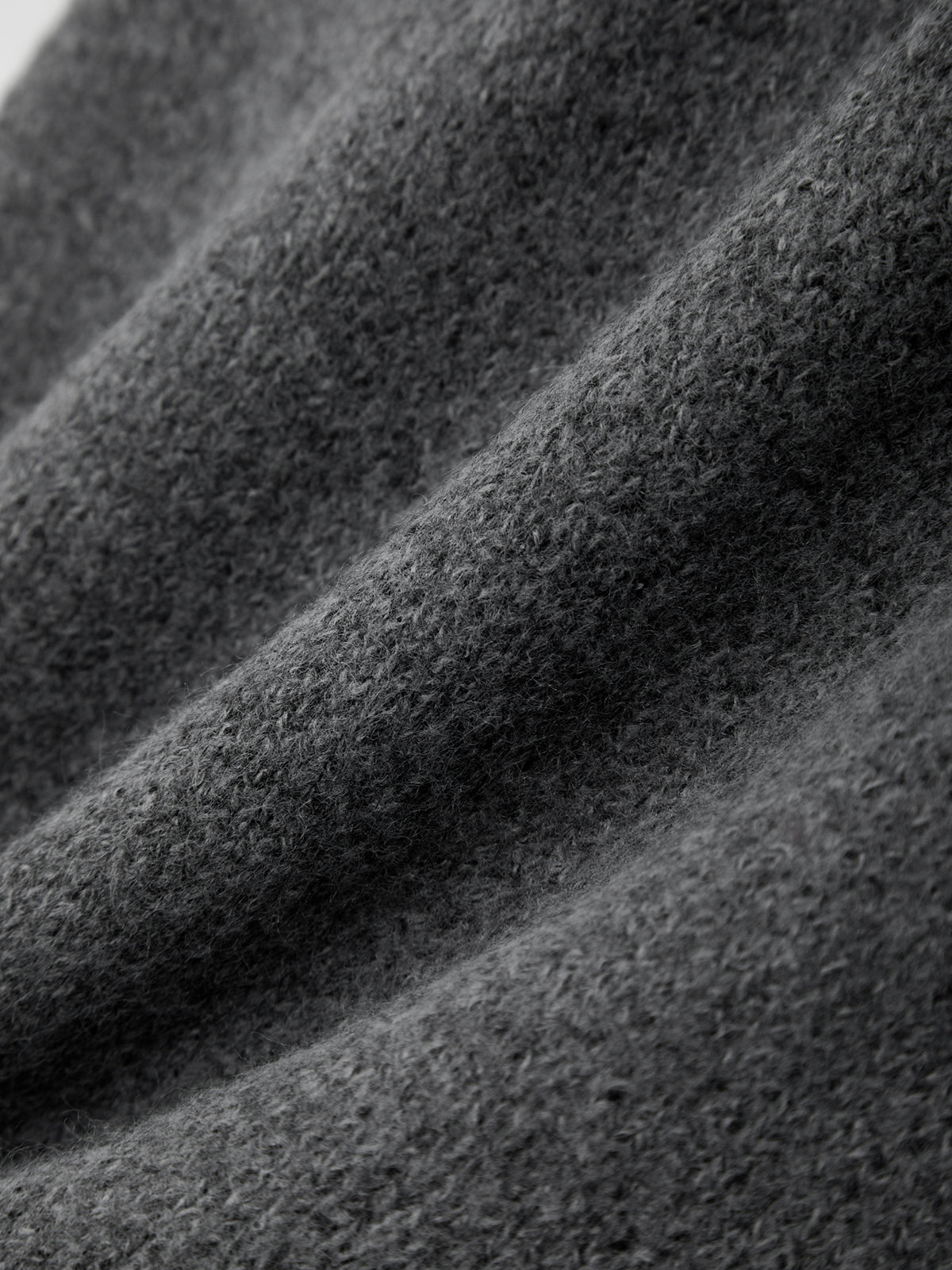 Close-up of textured black fabric with wavy pattern