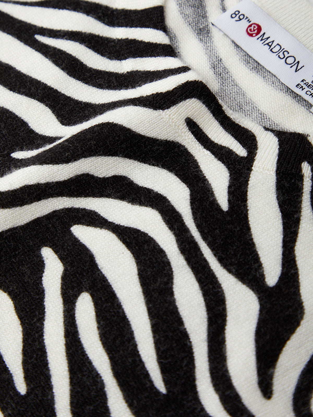 Zebra pattern fabric with a visible label in the corner