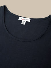 Close-up of a black scoop-neck t-shirt with a visible white neck label reading '89 MADSON'.
