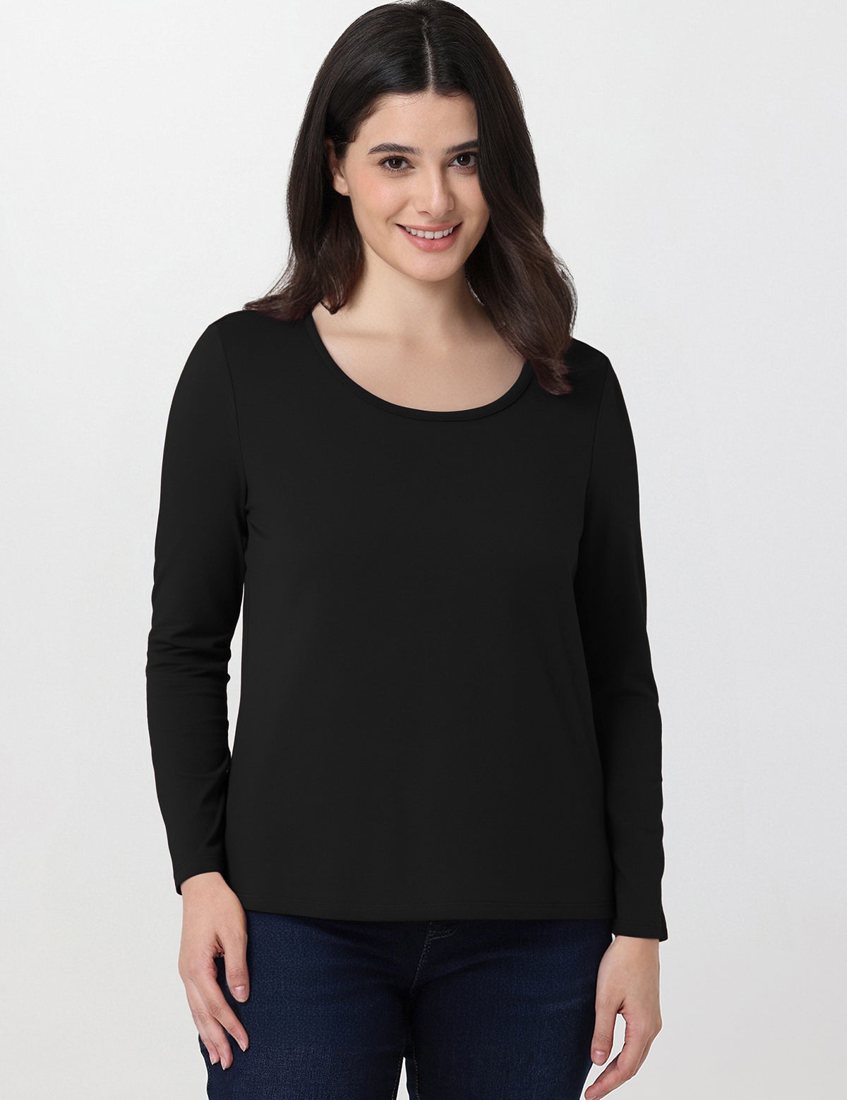Woman wearing a black long-sleeve top on a white background