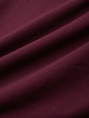 Close-up of burgundy fabric with folds