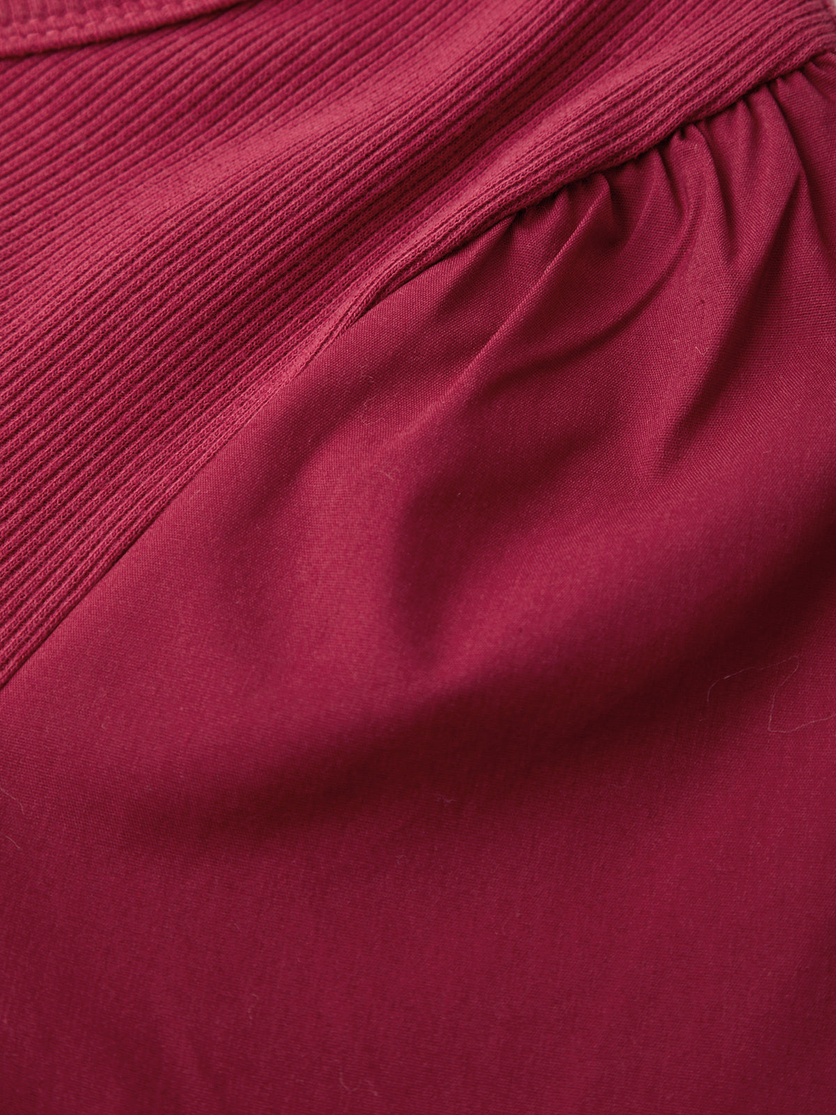 Close-up of a maroon fabric texture