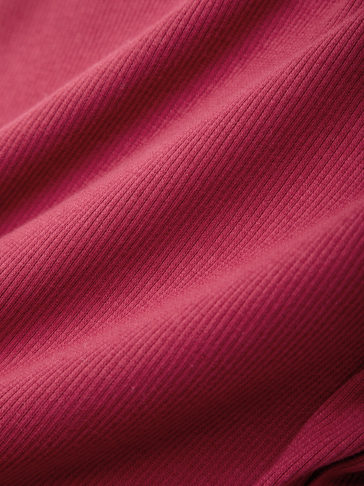 Close-up of a textured pink fabric surface
