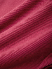 Close-up of a textured pink fabric surface