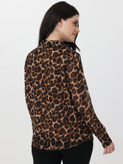 Woman wearing a leopard print blouse on a white background