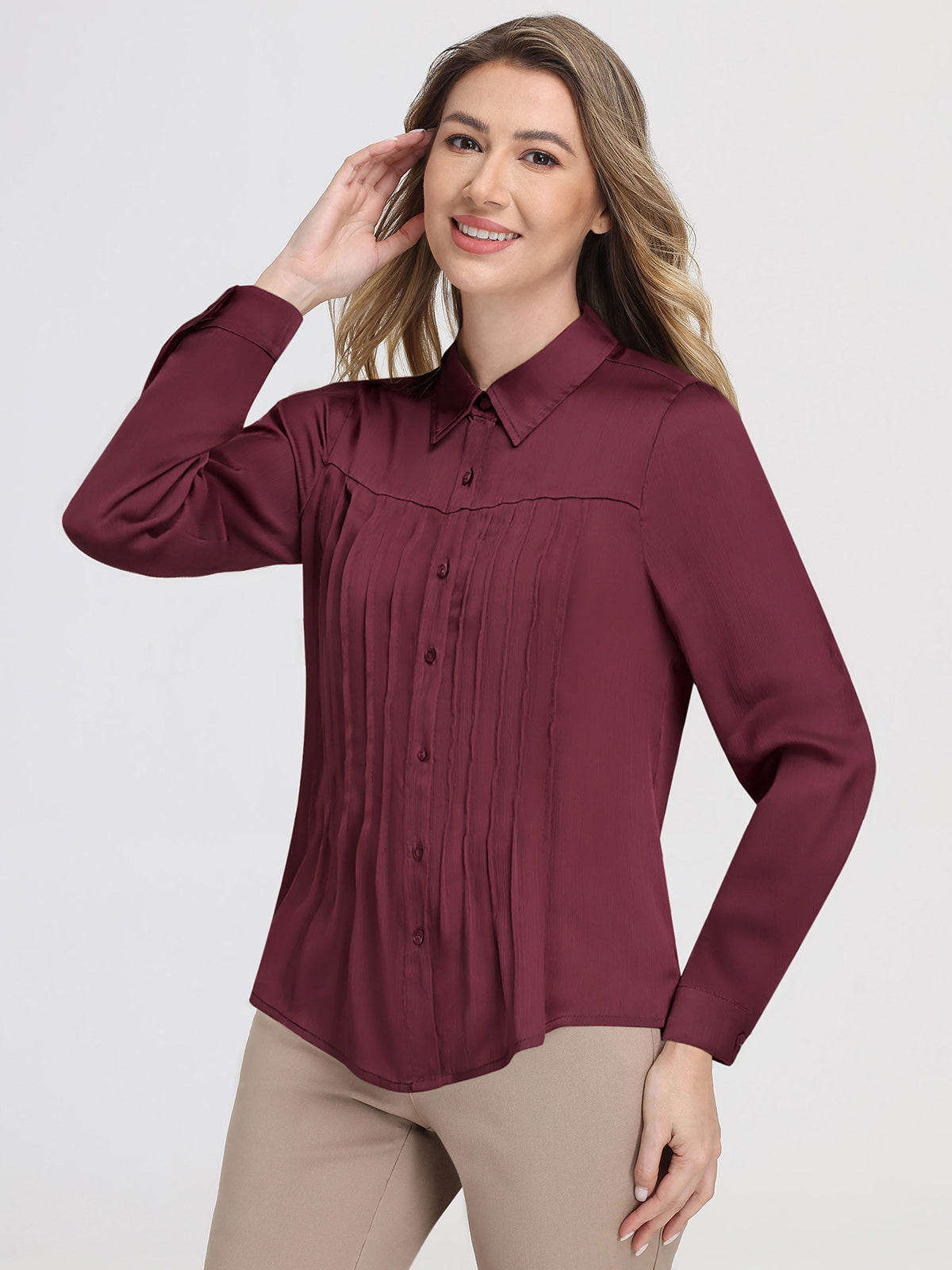 Woman wearing a burgundy shirt on a white background