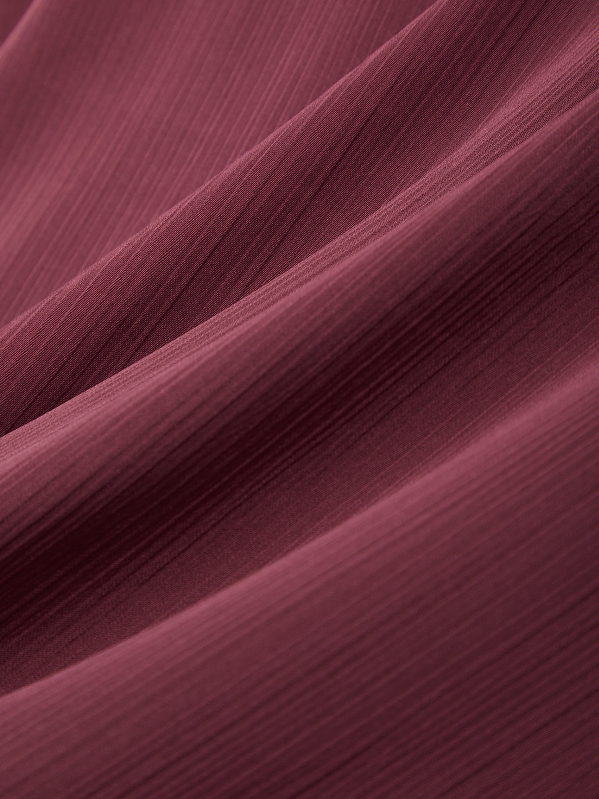 Close-up of maroon fabric with a soft texture