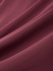 Close-up of maroon fabric with a soft texture