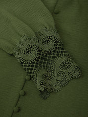 Green fabric with lace detailing and buttons