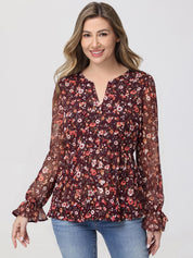 Woman wearing a floral blouse with long sleeves on a white background