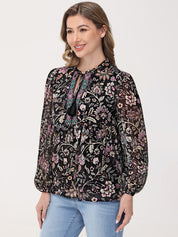 Woman wearing a floral blouse with long sleeves on a white background
