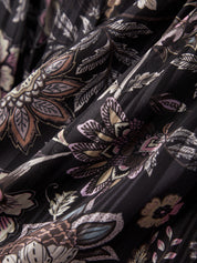 Close-up of floral patterned fabric with black background
