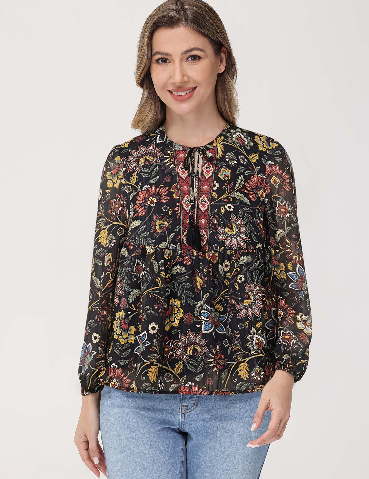 Woman wearing a floral blouse with a plain background