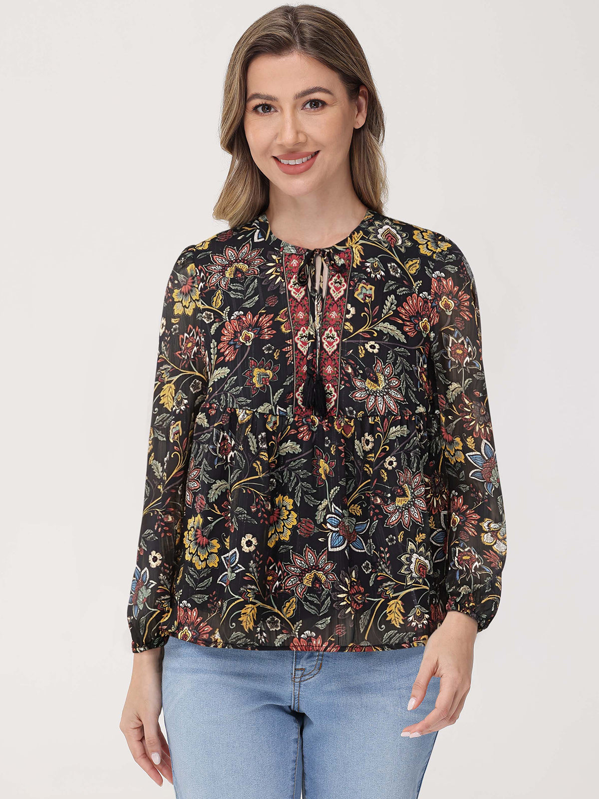 Woman wearing a floral blouse with a plain background