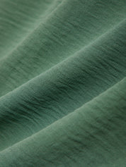 Close-up of green fabric with visible texture