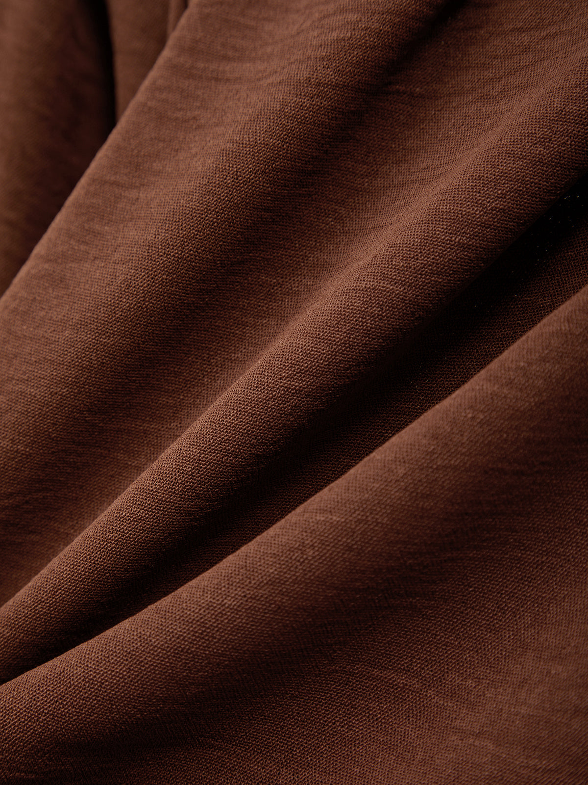 Close-up of brown fabric with visible texture