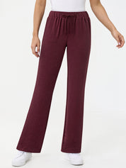 Maroon pants worn by a person on a white background