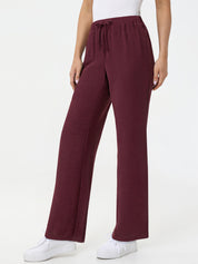 Maroon wide-leg pants worn by a person on a white background
