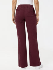 Maroon pants worn by a person on a white background