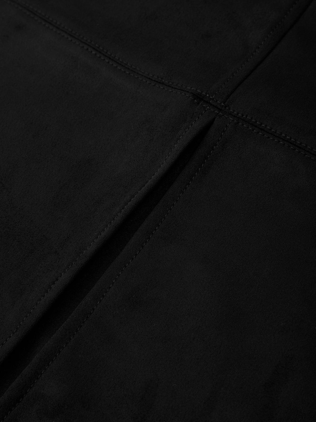 Close-up of black fabric with a visible seam