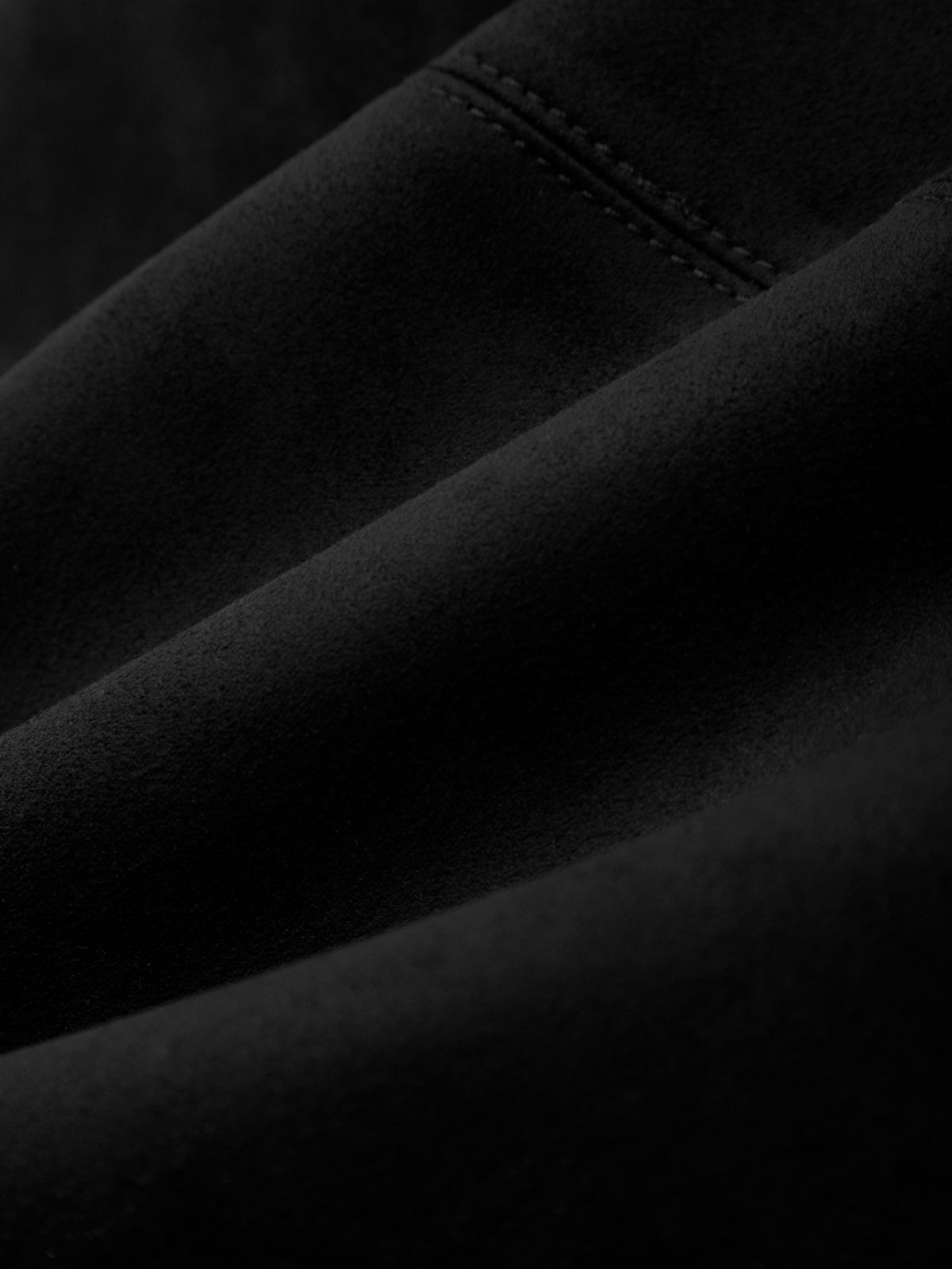 Close-up of black fabric with stitching detail