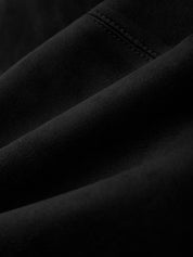 Close-up of black fabric with stitching detail