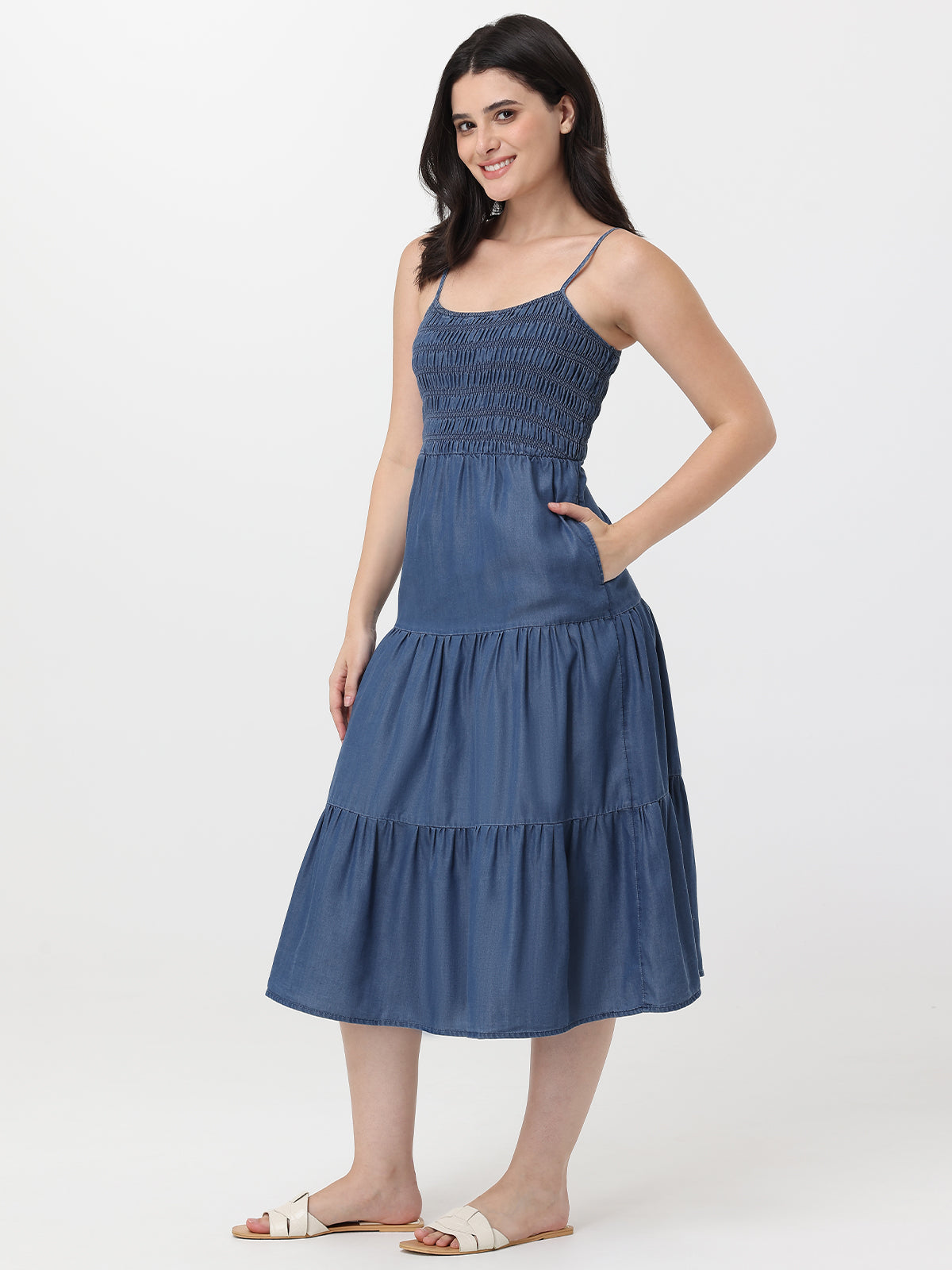 Woman wearing a blue dress on a white background