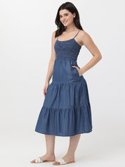 Woman wearing a blue dress on a white background