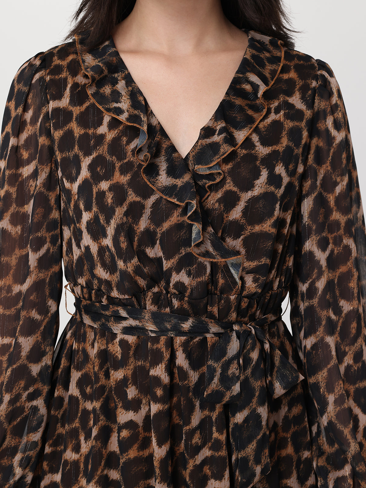 Leopard print dress with a ruffled neckline on a white background