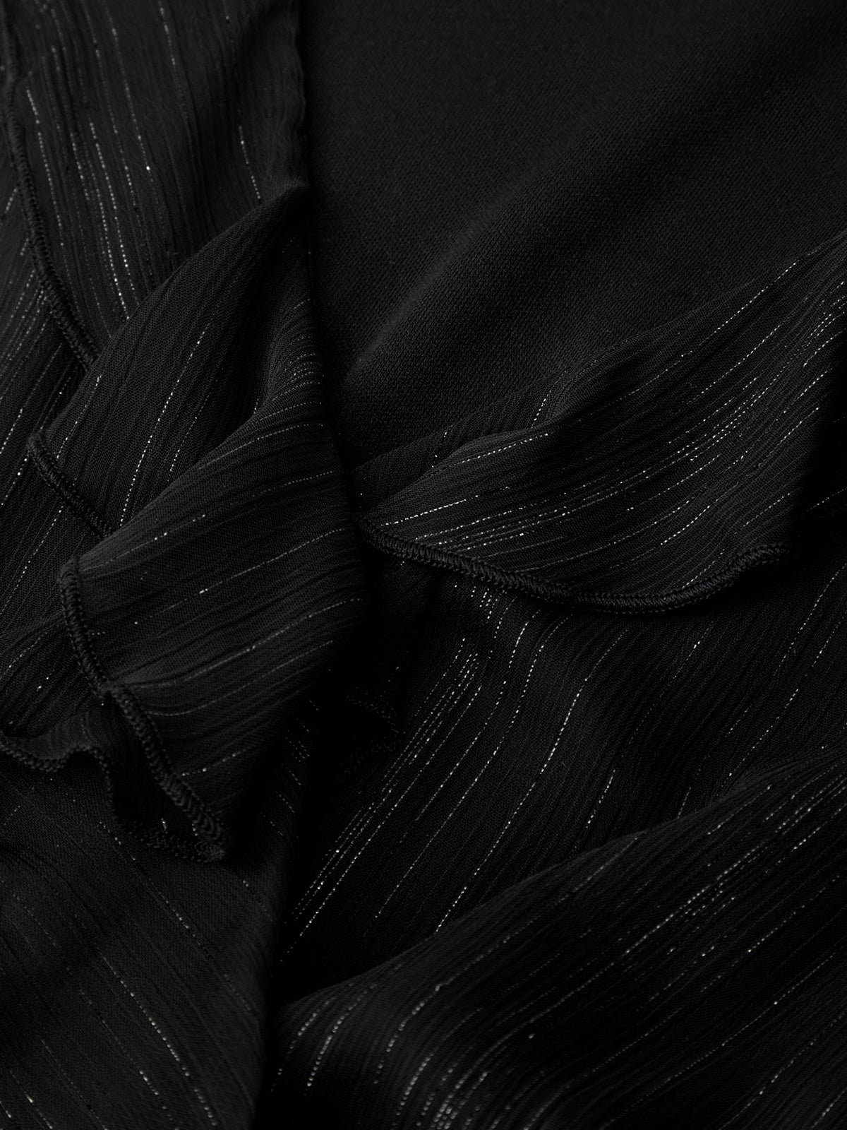 Close-up of black fabric with a textured pattern