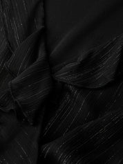 Close-up of black fabric with a textured pattern