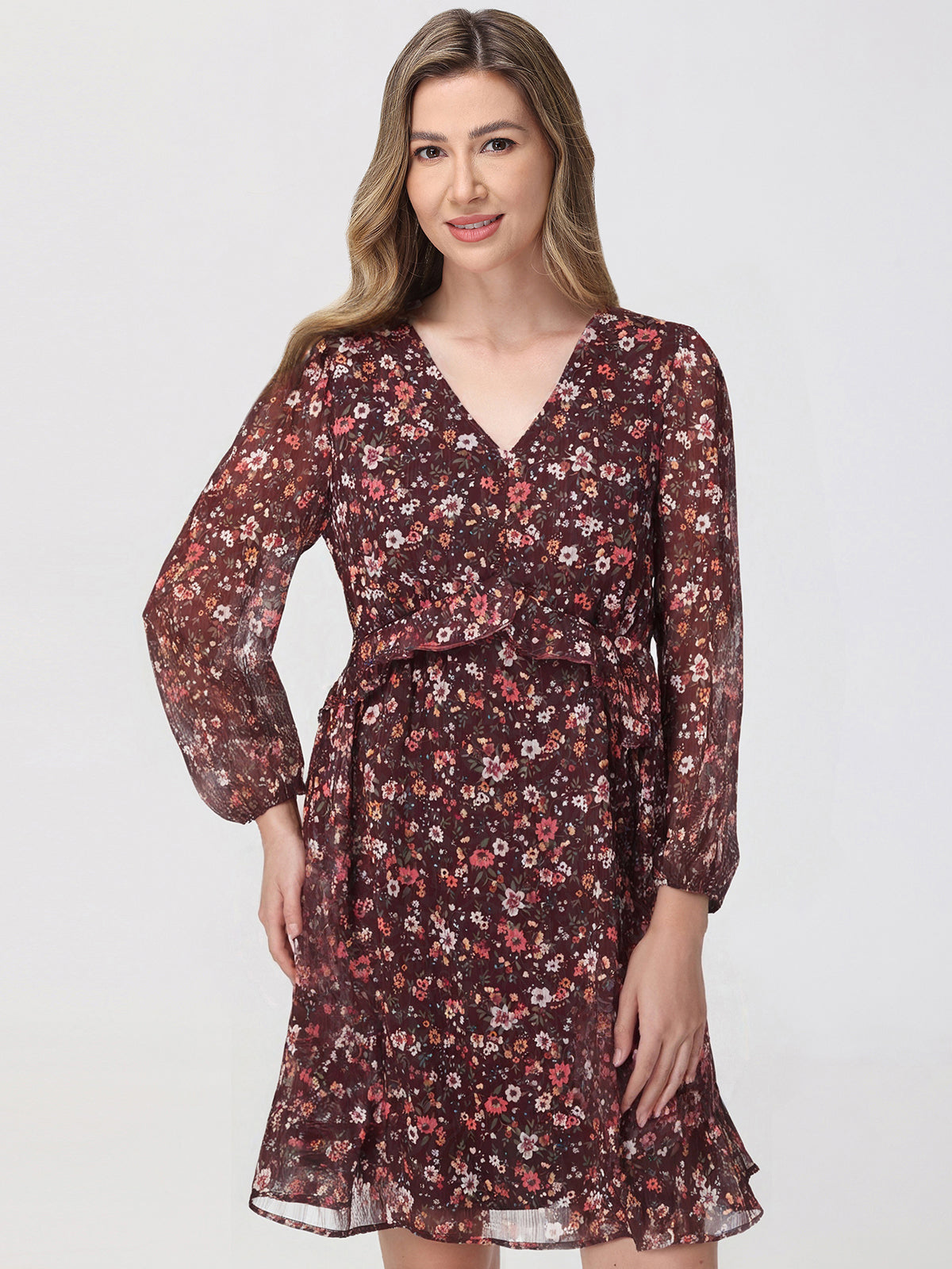 Woman wearing a floral dress on a white background