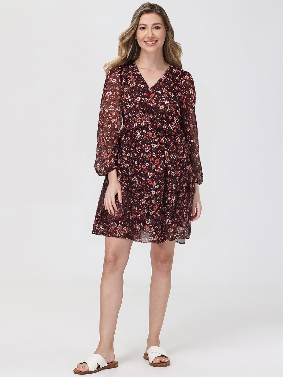 Woman wearing a floral dress on a white background