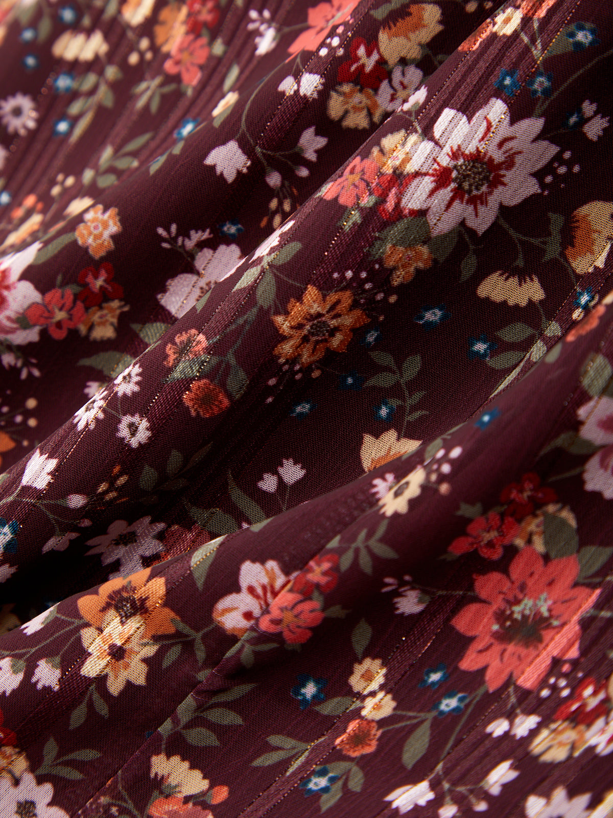 Close-up of floral fabric with a dark purple background
