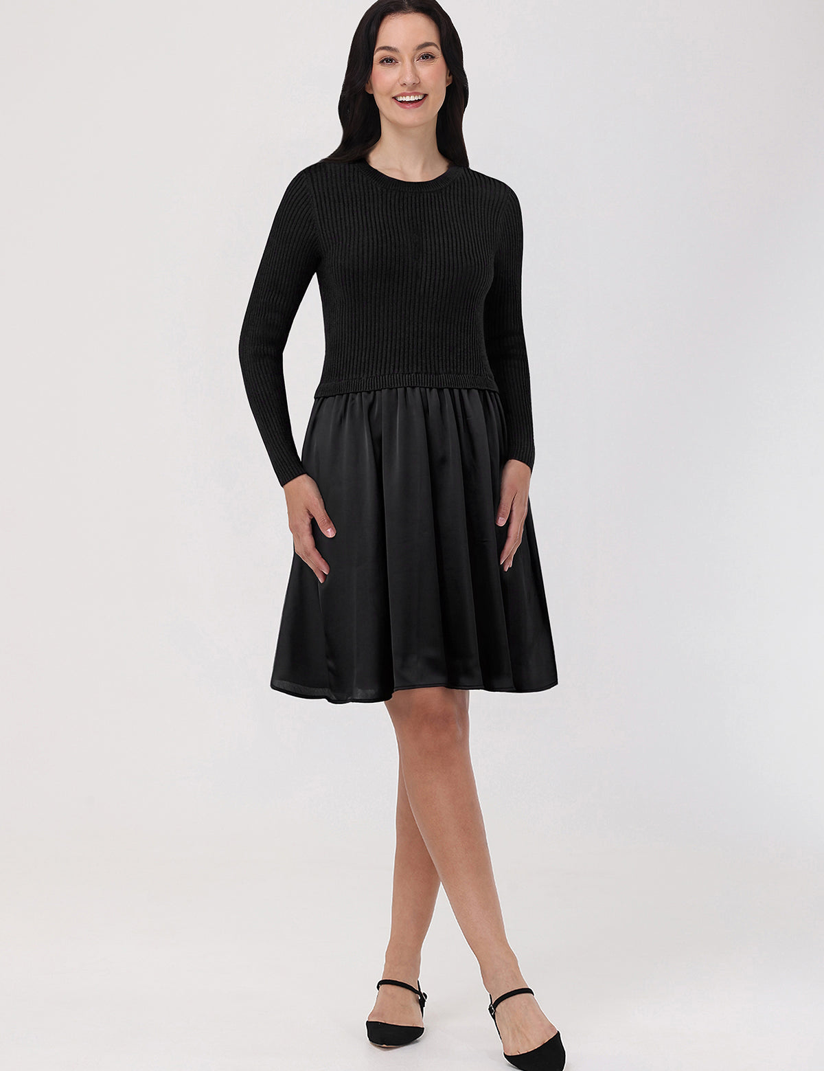 Woman wearing a black dress with a white background