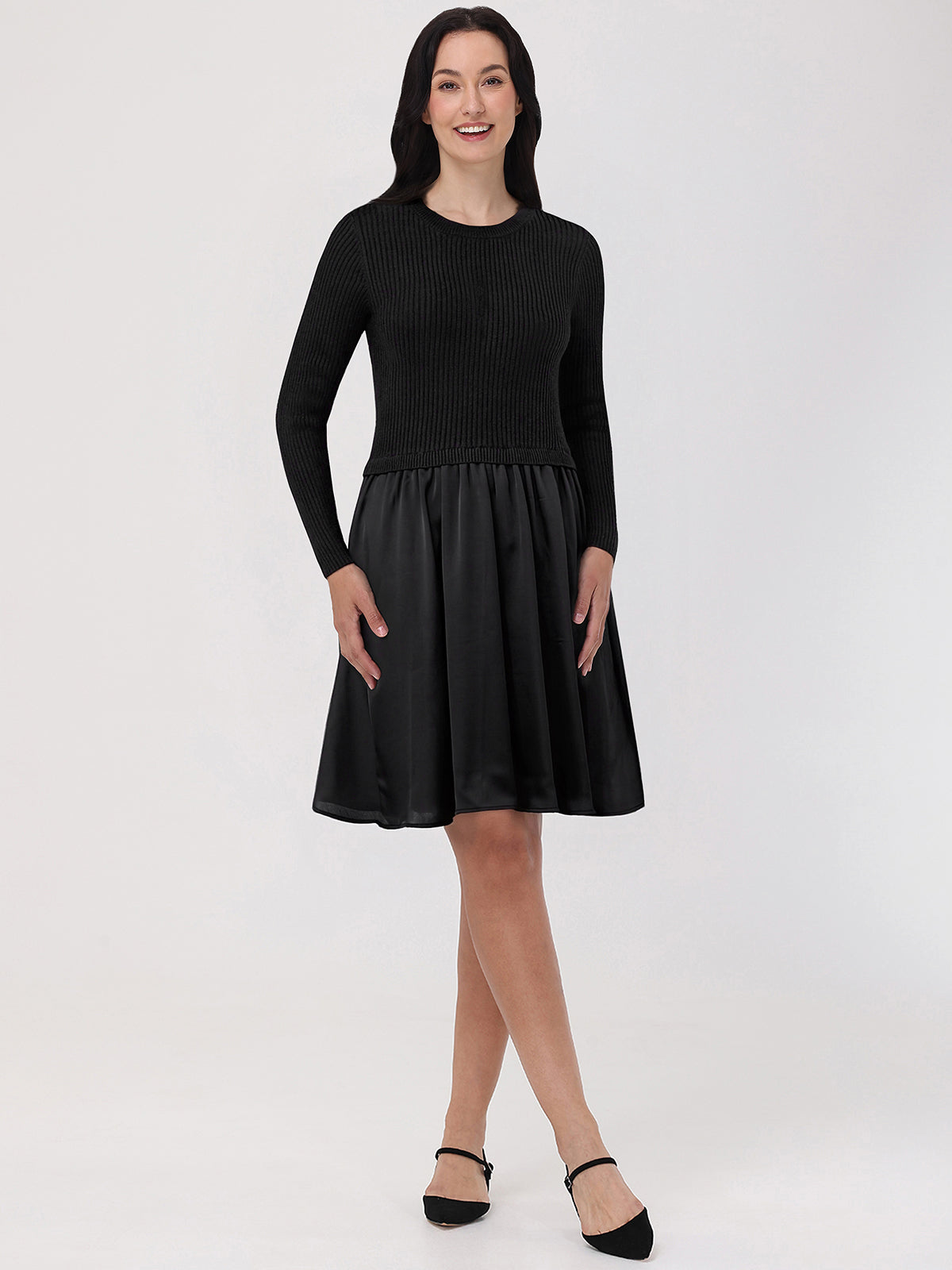 Woman wearing a black dress with a white background