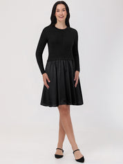 Woman wearing a black dress with a white background