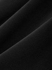 Close-up of a textured black surface with diagonal lines