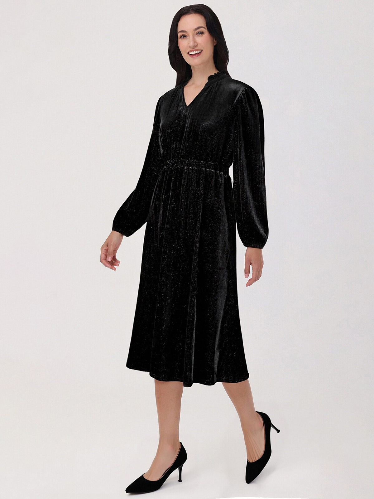 Woman wearing a black dress on a white background