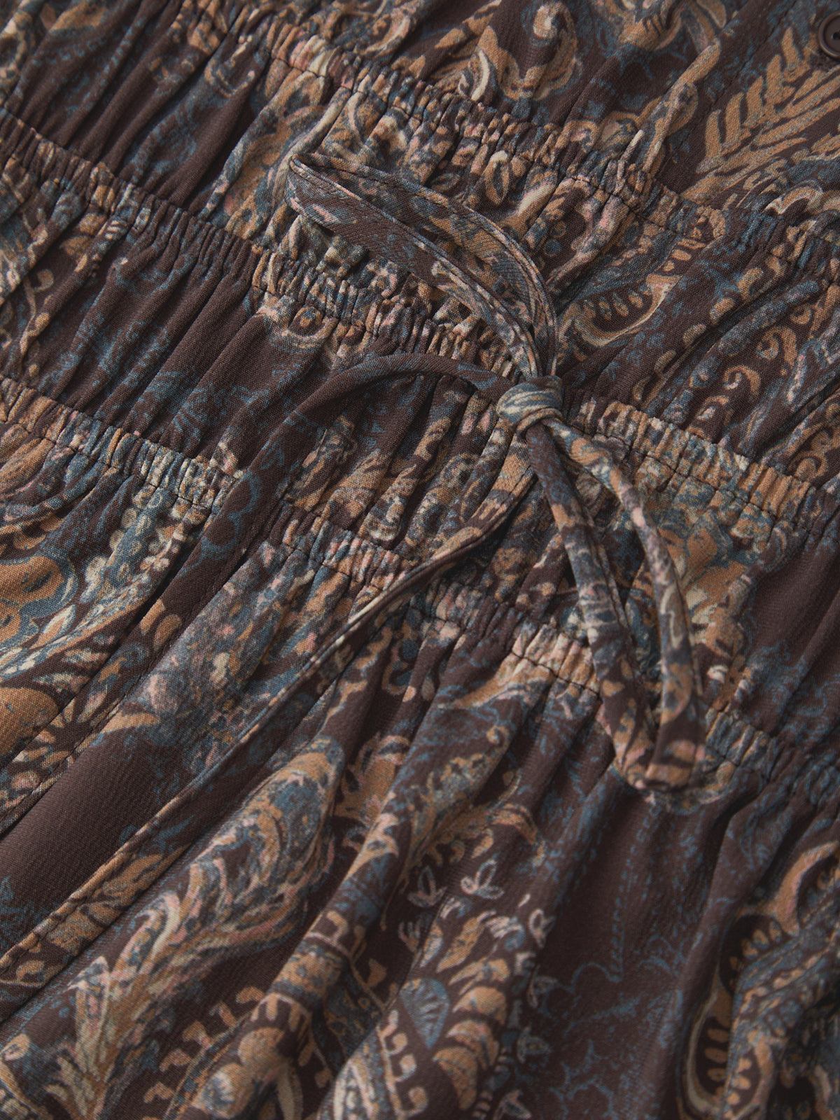 Close-up of a patterned fabric with a tie detail