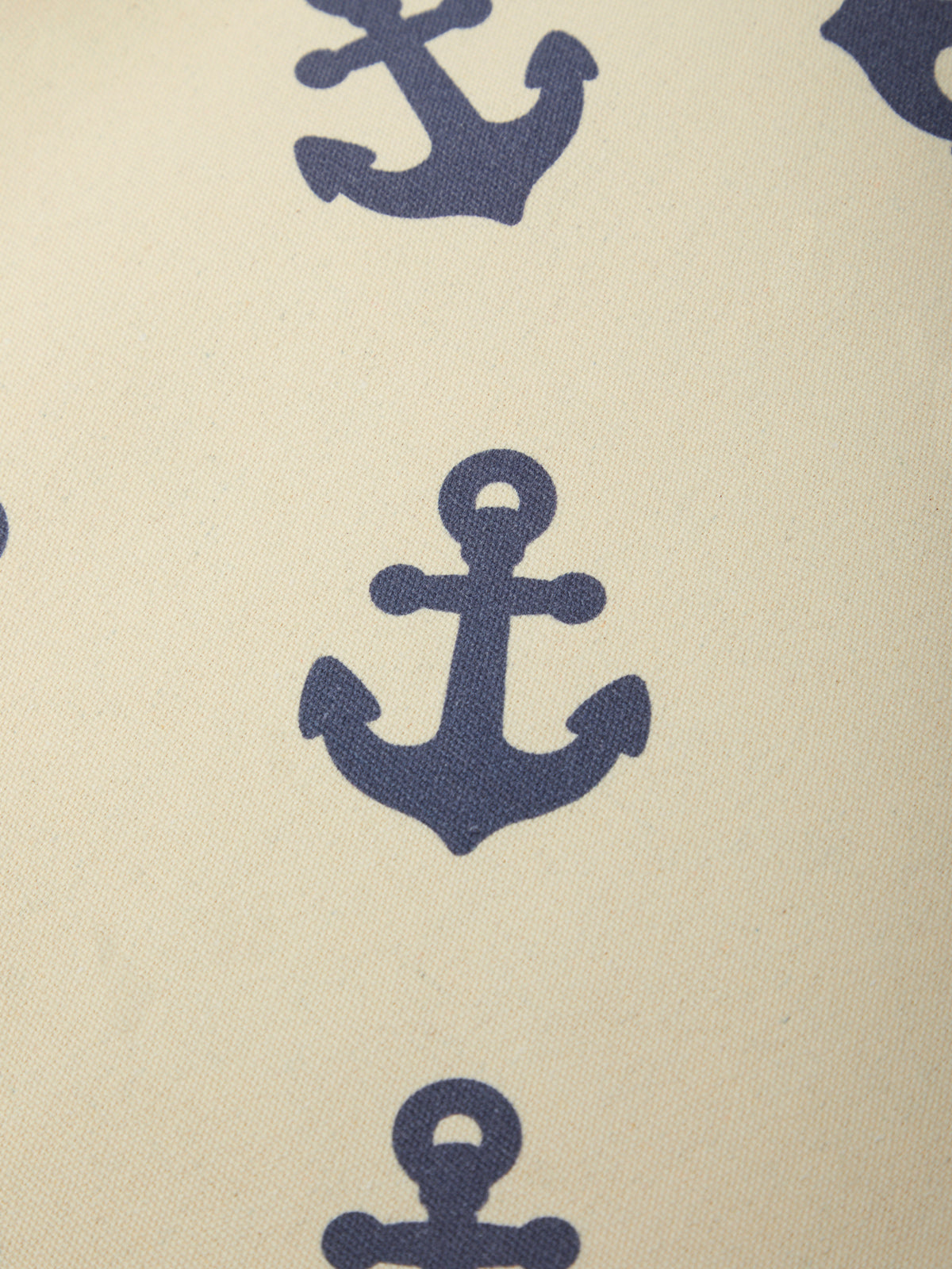 Pattern of blue anchors on a beige background