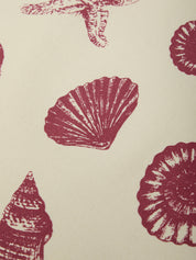 Pattern of red shell designs on a beige background