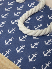 Nautical-themed rug with white anchors on a blue background, featuring a rope border.