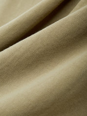 Close-up of olive green fabric with a soft texture